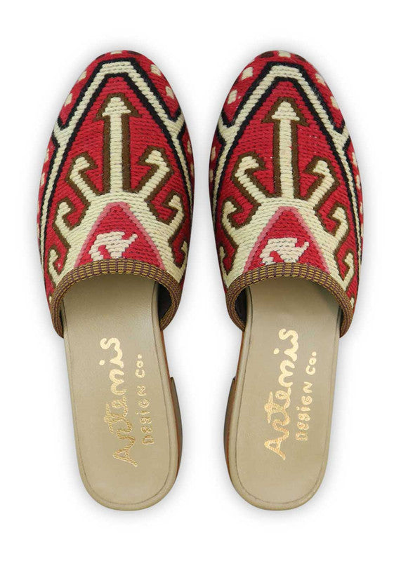 The Artemis Women's Slides present a striking color ensemble of red, white, black, and pink. These slides combine bold and neutral tones, creating a vibrant and stylish appearance. Whether you're relaxing at home or stepping out for a casual outing, these slides are the ideal choice. (Front View)