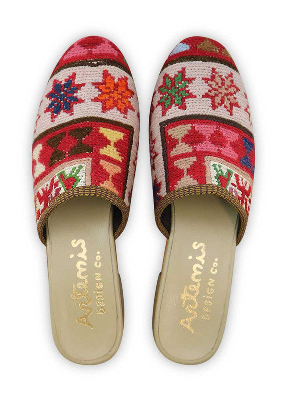 The Artemis Women's Slides showcase a lively color combination of red, white, green, teal, pink, peach, brown, and khaki. These slides offer a vibrant blend of bold and soft tones, creating a playful and stylish look. Whether you're unwinding by the pool or heading out for a casual outing, these slides are the perfect choice. (Front View)