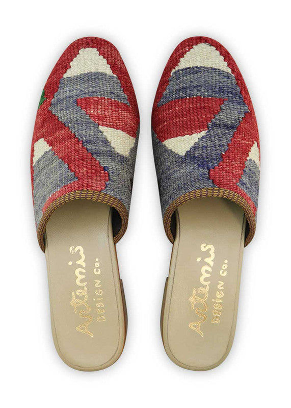 The Artemis Women's Slides feature a classic color combination of red, white, blue, green, and black. These slides offer a timeless blend of patriotic and versatile tones, creating a stylish and adaptable look. Whether you're lounging at home or stepping out for a casual outing, these slides are the perfect choice. (Front View)