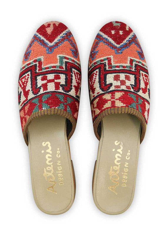 The Artemis Women's Slides showcase a lively color combination of red, white, green, teal, pink, peach, brown, and khaki. These slides offer a vibrant blend of bold and soft tones, creating a playful and stylish look. Whether you're unwinding by the pool or heading out for a casual outing, these slides are the perfect choice. (Front View)