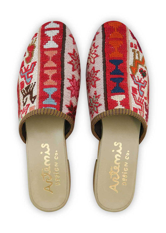 The Artemis Women's Slides showcase a lively color combination of red, white, green, teal, pink, peach, brown, and khaki. These slides offer a vibrant blend of bold and soft tones, creating a playful and stylish look. Whether you're unwinding by the pool or heading out for a casual outing, these slides are the perfect choice. (Front View)