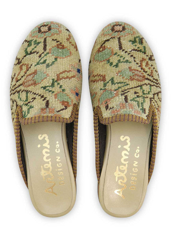 The Artemis Design& Co Women's Slippers in yellow, peach, blue, green, white, and black are a vibrant and stylish choice for women. These slippers feature a unique color combination that adds a pop of color to your loungewear or casual outfits. (Front View)