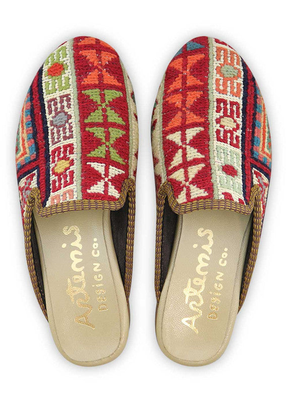 The Artemis Design& Co Women's Slippers are a stylish and versatile choice for any woman. These slippers feature a unique color combination of red, black, blue, mustard, green, and teal. Crafted with high-quality materials and attention to detail, these slippers offer durability and long-lasting comfort.  (Front View)