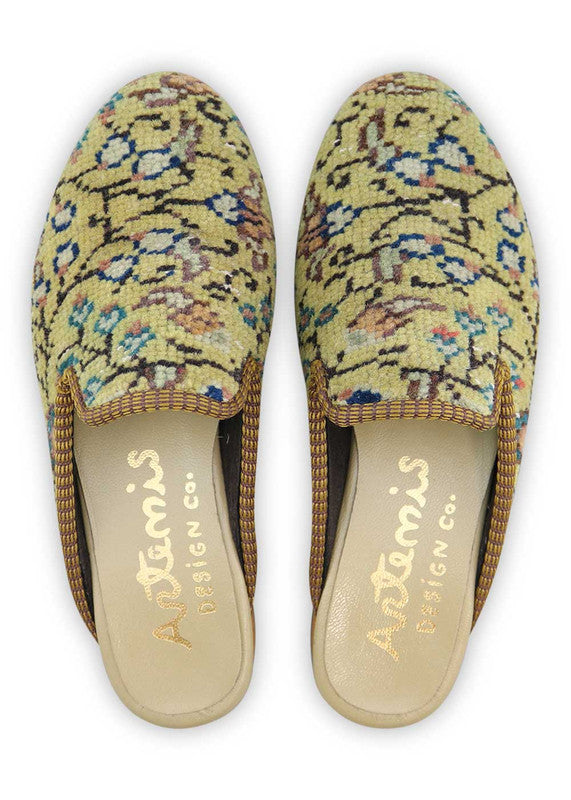 The Artemis Design& Co Women's Slippers in yellow, peach, blue, green, white, and black are a vibrant and stylish choice for women. These slippers feature a unique color combination that adds a pop of color to your loungewear or casual outfits. (Front View)