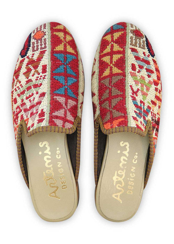 Artemis Design& Co Women's Slippers are a stylish and comfortable choice for any woman. These slippers feature a unique color combination of red, white, blue, peach, orange, pink, and mustard, adding vibrancy and flair to your outfit. Crafted with high-quality materials and attention to detail, these slippers offer both durability and comfort. (Front View)
