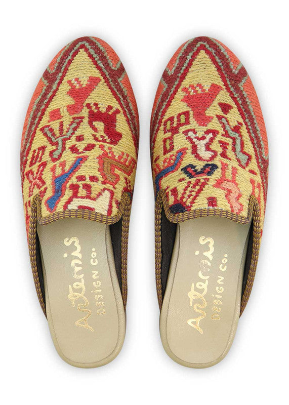 The Artemis Women's Slippers showcase a captivating spectrum of colors, featuring orange, brown, sky blue, khaki, cream, and maroon. These slippers seamlessly blend the vibrant bursts of orange with the natural warmth of brown and khaki, complemented by the calming shades of sky blue and cream, and enriched by the regal allure of maroon. (Front View)