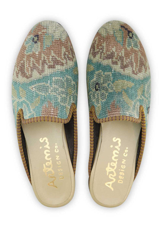 The Artemis Women's Slippers exude a harmonious blend of colors, featuring sky blue, white, light brown, black, and grey. These slippers seamlessly blend the calming tones of sky blue and white with the natural warmth of light brown, complemented by the classic appeal of black and the neutral charm of grey. (Front View)