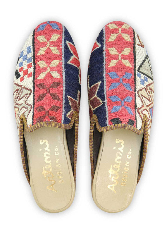 The Artemis Women's Slippers showcase a captivating blend of colors, featuring navy blue, brown, red, white, cream, sky blue, and black. These slippers seamlessly blend the timeless charm of navy blue, brown, and black with the boldness of red, complemented by the classic appeal of white and the softness of cream and sky blue.  (Front View)