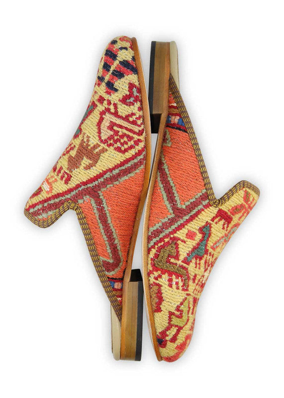 The Artemis Women's Slippers radiate a vivid tapestry of colors, including white, red, green, purple, sky blue, teal, pink, and orange. These slippers seamlessly blend the classic appeal of white with the vibrancy of red, green, and orange, enriched by the regal charm of purple and the serene shades of sky blue, teal, and pink. (Side View)
