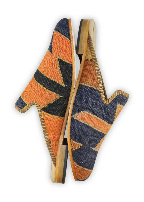 The Artemis Women's Slippers offer a captivating fusion of colors, featuring blue, orange, khaki, and rust. These slippers seamlessly blend the calming tones of blue with the energetic bursts of orange, complemented by the neutral charm of khaki and the warmth of rust. (Side View)