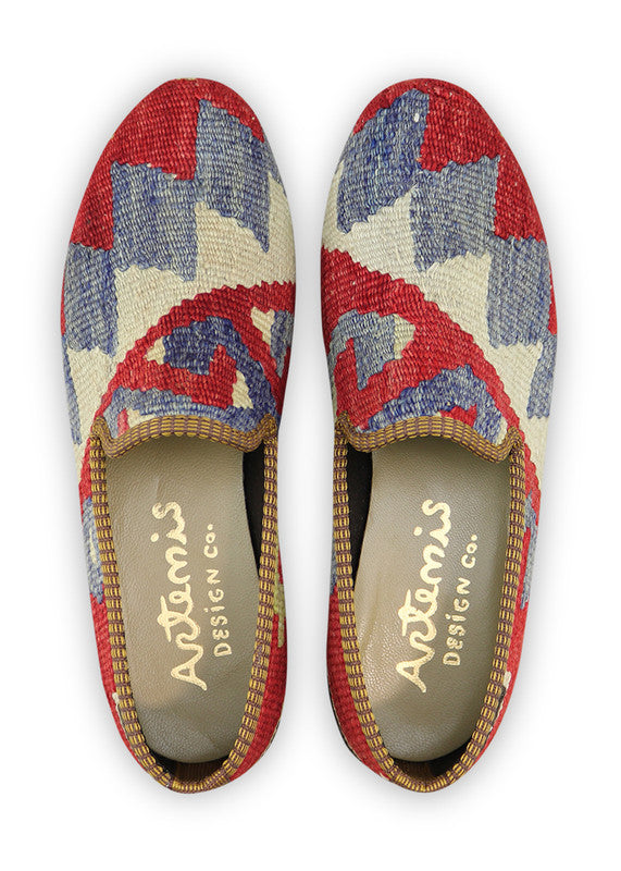 Artemis Design & Co Women's Smoking Shoes, featuring a bold and classic color combination of red, blue, white, green, and black, are a timeless and stylish addition to any wardrobe. These artisan-crafted smoking shoes effortlessly blend fashion and comfort. Their striking color palette adds a touch of sophistication and versatility to your fashion ensemble. (Front View)