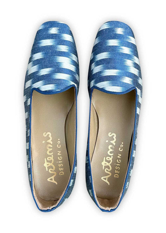 The Summer Silk Ikats loafers in a classic color combination of white and blue are a stylish and comfortable choice for the summer season. Crafted from lightweight silk ikat fabric, these loafers showcase a blend of colors that exude a sense of freshness and sophistication. The crisp white base provides a clean and versatile backdrop, while the soothing blue accents add a touch of elegance and tranquility. (Front View)