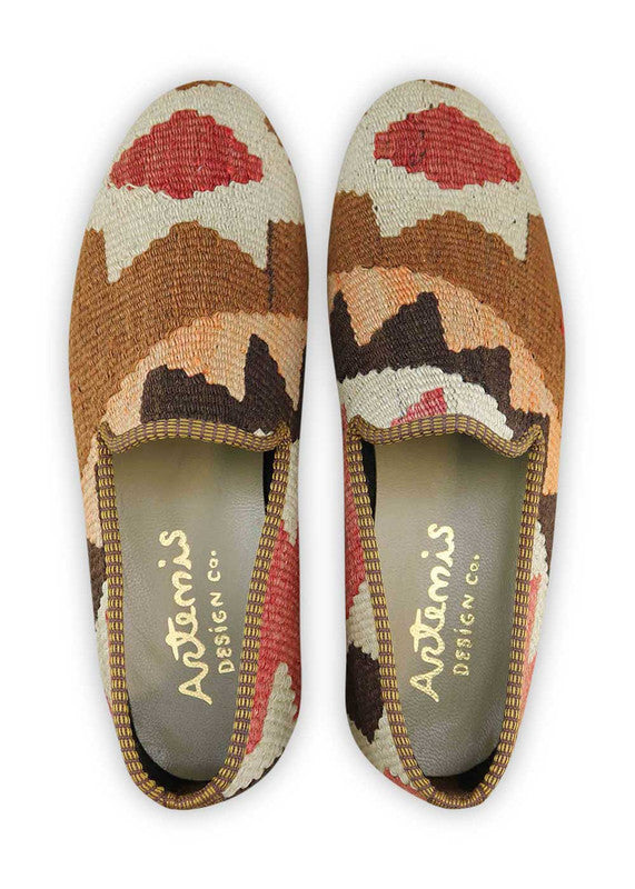 Artemis Shoes presents its men's loafers with a captivating color combination. The rich brown hue exudes warmth and earthy charm, while the light brown adds a subtle and versatile touch. The light orange brings a pop of energetic and playful color, perfectly balanced by the confident red. The light green injects a fresh and natural twist to the design.  (Front View)