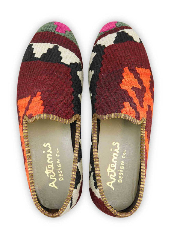Artemis Shoes presents its men's loafers featuring a captivating color combination. The classic black offers timeless sophistication, while the clean white adds a crisp and versatile touch. The maroon hue adds a touch of richness and elegance, complemented by the dark grey for a sleek and refined look. The fuschia pink injects a vibrant pop of personality, while the orange adds a bold and energetic accent. (Front View)