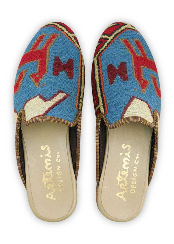 The Artemis Men's Slippers feature a classic color combination of blue, red, white, khaki, and black. These slippers offer a timeless blend of bold and neutral tones, creating a versatile and stylish look. (Front View)