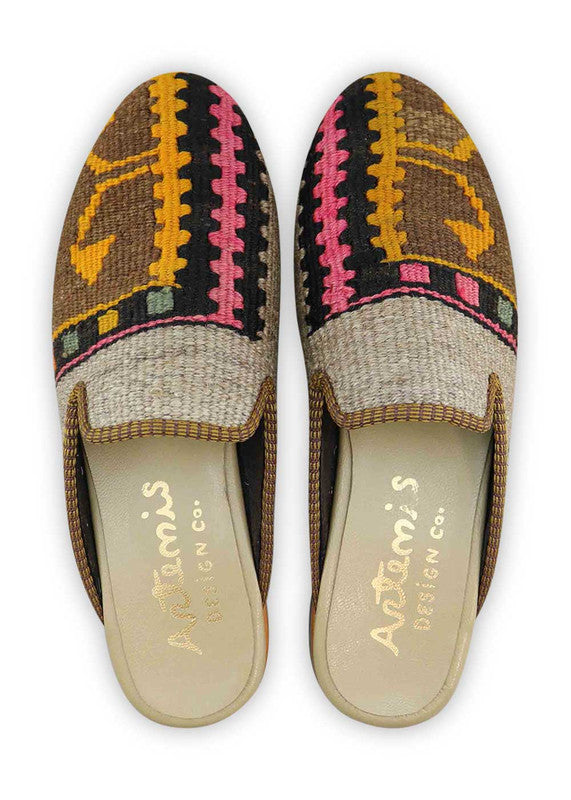 The Artemis Men's Slippers showcase a vibrant color combination of black, fuschia, orange, green, yellow orange, brown, and khaki. These slippers offer an energetic mix of bold and earthy tones, creating a stylish and eye-catching look. (Front View)