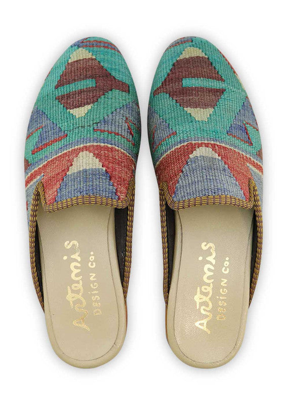 The Artemis Men's Slippers feature a dynamic color combination of teal, red, blue, maroon, and white. These slippers offer an energetic mix of bold and neutral tones, creating a stylish and eye-catching look. (Front View)
