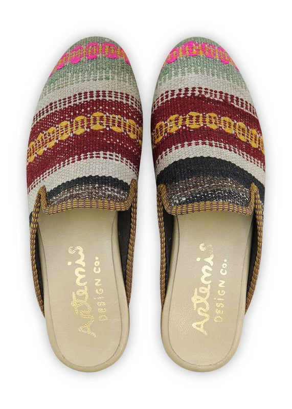 The Artemis Men's Slippers feature a vibrant color combination of grey, fuschia, maroon, orange, grey, brown, and orange. These slippers offer a lively mix of bold and neutral tones, creating a stylish and eye-catching look. (Front View)