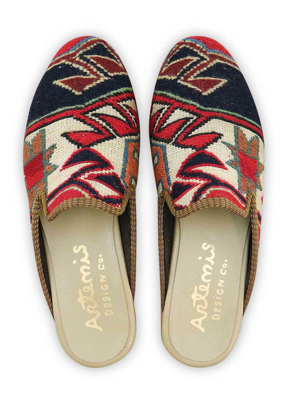 The Artemis Men's Slippers showcase a captivating color combination of red, white, black, rust, teal, and grey. These slippers offer a vibrant mix of bold and neutral tones, creating a stylish and eye-catching look. (Front View)