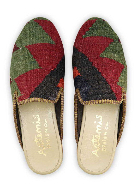 The Artemis Men's Slippers feature an intriguing color combination of moss green, maroon, black, red, orange, and brown. These slippers offer a mix of earthy and vibrant tones, creating a stylish and eye-catching look. Whether you're unwinding at home or stepping out for a casual outing, these slippers are the perfect choice. (Front View)