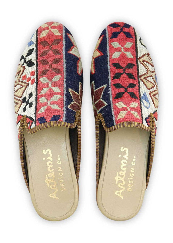 The Artemis Men's Slippers feature a dynamic color combination of navy blue, white, red orange, maroon, khaki, brown, black, and white. These slippers offer a vibrant mix of bold and neutral tones, creating a stylish and eye-catching look. Whether you're unwinding at home or stepping out for a casual outing, these slippers are the perfect choice. (Front View)