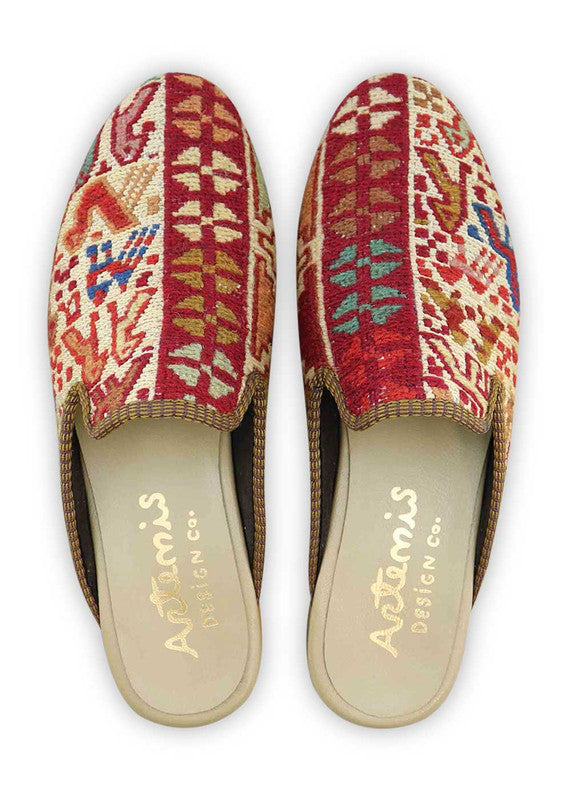 The Artemis Men's Slippers present a vibrant color combination of red, pink, brown, green, white, orange, and blue. These slippers offer a lively mix of bold and soft tones, creating a stylish and eye-catching look. Whether you're relaxing at home or stepping out for a casual outing, these slippers are the perfect choice. ( Front View)