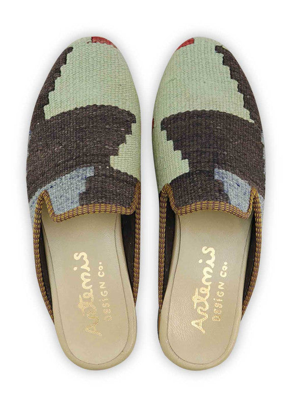 The Artemis Men's Slippers feature a sleek color combination of grey, dark grey, red, and blue. These slippers offer a stylish blend of neutral and bold tones, creating a modern and versatile look. (Front View)