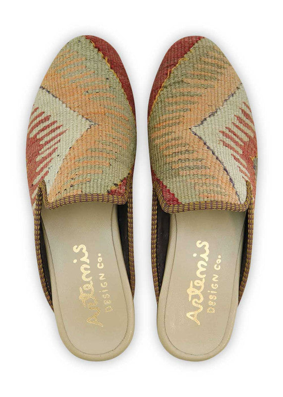 The Artemis Men's Slippers feature a balanced color combination of red, grey, khaki, and light orange. These slippers offer a stylish blend of bold and neutral tones, creating a versatile and modern look. Whether you're relaxing at home or stepping out for a casual outing, these slippers are the perfect choice. (Front View)