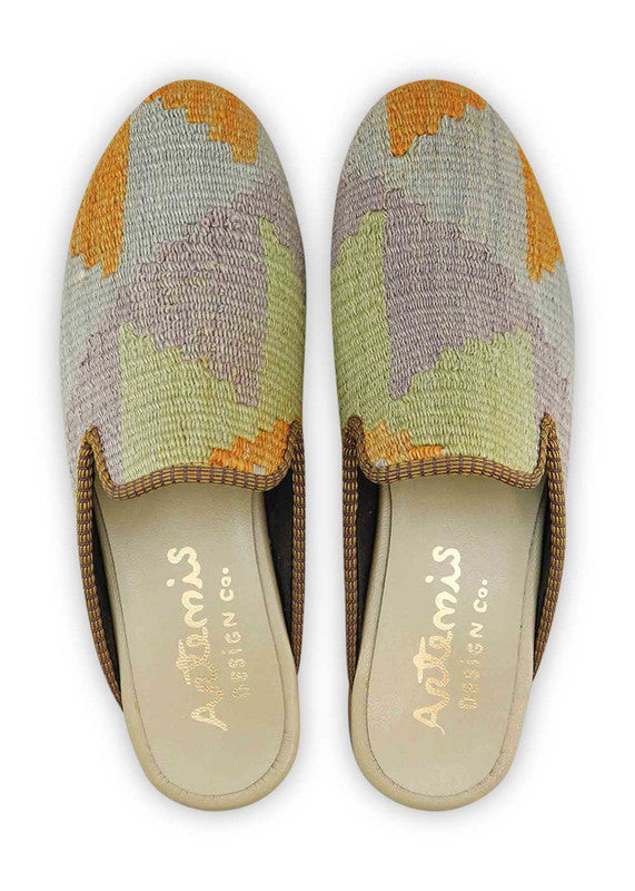 The Artemis Men's Slippers showcase a charming color combination of lilac, mustard, mint green, and grey. These slippers offer a delightful mix of soft and earthy tones, creating a stylish and versatile look. Whether you're relaxing at home or stepping out for a casual outing, these slippers are the perfect choice.  (Front  View) 