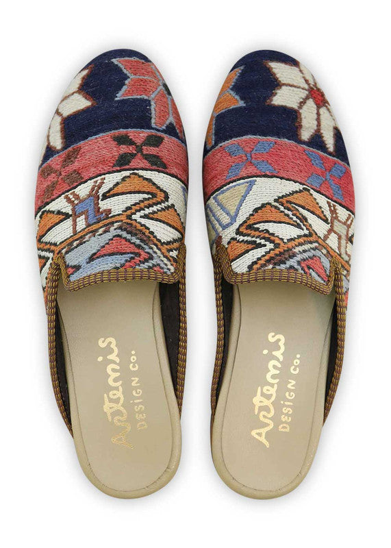 Artemis Men's Slippers in the color combination of navy blue, sky blue, white, red, orange, and khaki offer a vibrant and versatile style. The rich navy blue serves as a sophisticated base, while the sky blue and white accents add a refreshing and airy touch. The pops of red and orange inject a bold and energetic element, while the khaki highlights provide a natural and earthy contrast. (Front View)