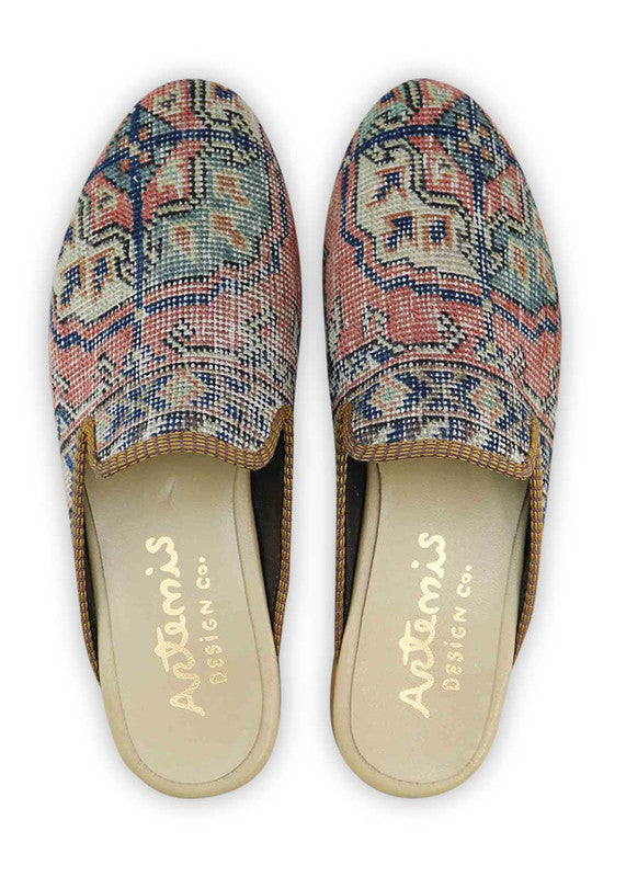 Artemis Men's Slippers in the color combination of peach, blue, off white, and light green offer a refreshing and contemporary aesthetic. The soft and warm peach tone adds a touch of elegance, while the blue accents bring a cool and calming vibe. The off white elements provide a clean and sophisticated contrast, and the light green highlights add a pop of freshness.  (Front View)