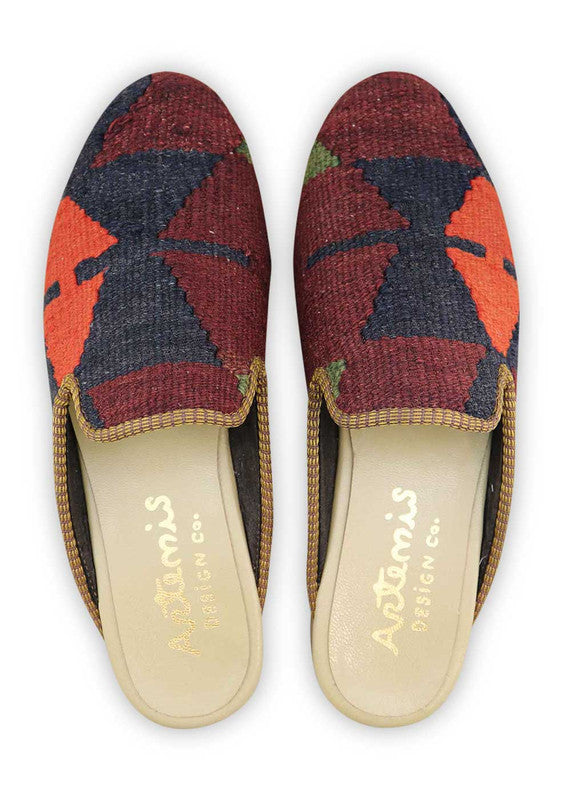 Artemis Men's Slippers in the color combination of maroon, moss green, black, and red orange offer a bold and dynamic look. The rich maroon hue adds a touch of elegance, while the moss green accents bring a natural and earthy vibe. The black elements provide a sleek and classic contrast, while the pops of red orange inject a vibrant and energetic feel. (Front View)