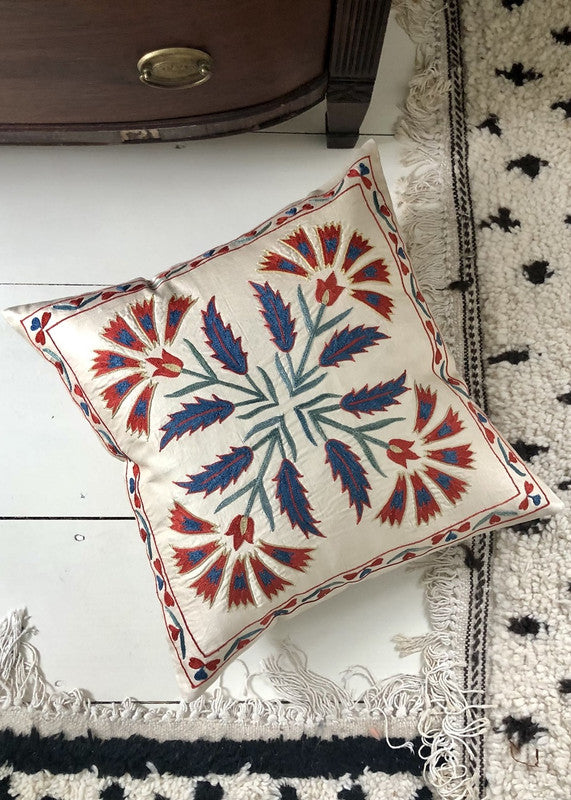 suzani-pillow-on-white-floor