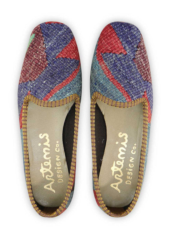 The Artemis Women's Loafer showcases a captivating color combination of purple, white, red, green, black, maroon, blue, and orange. These loafers present a vibrant and eye-catching mix of hues, making them a standout accessory for any outfit. Whether you're dressing up for a special occasion or seeking a chic yet comfortable option for everyday wear, these loafers are the perfect choice to add a pop of color to your look.  ( Front View)