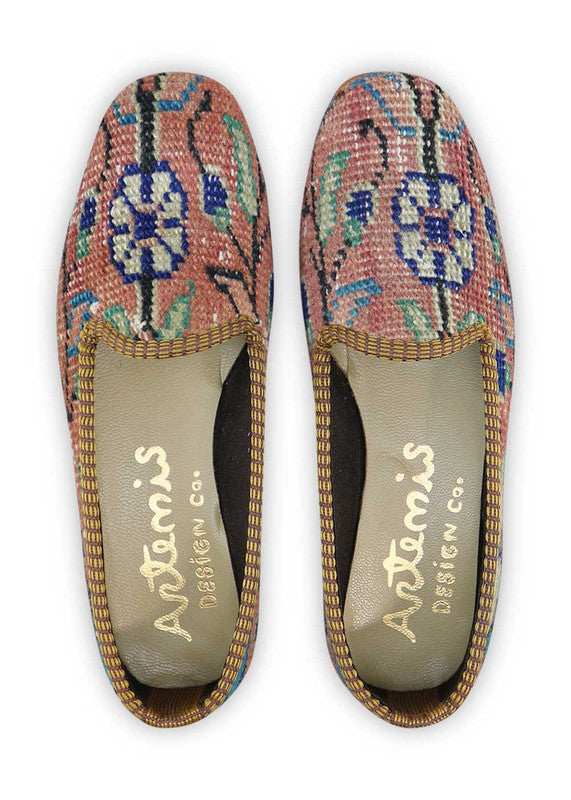 The Artemis Women's Loafer showcases a captivating color combination of peach, black, violet, blue, white, and green. These loafers offer a beautiful mix of soft and bold tones, creating a stylish and versatile look. Whether you're dressing up for a special occasion or seeking a chic yet comfortable option for everyday wear, these loafers are the perfect choice.  (Front View)