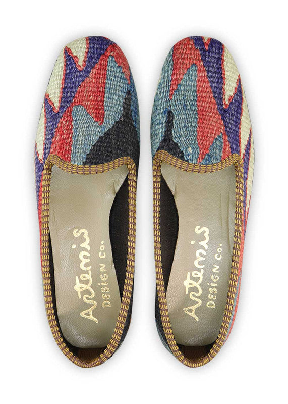 The Artemis Women's Loafer features a chic and versatile color combination of black, khaki, green, grey, blue, red, and purple. These loafers offer a tasteful mix of neutral and vibrant tones, making them a perfect addition to any outfit. (Front View)
