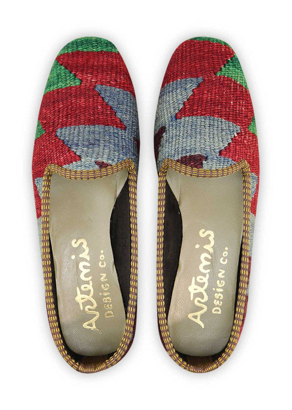 The Artemis Women's Loafer showcases a striking color combination of red, blue, black, yellow, purple, and green. These loafers are a true feast for the eyes, featuring a bold and vibrant mix of colors that will instantly elevate your style. (Front View)
