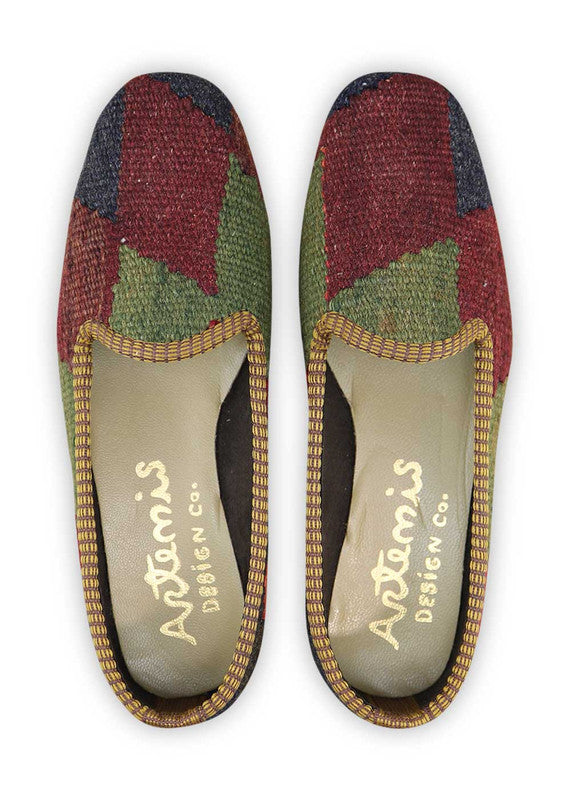 The Artemis Women's Loafer boasts an exquisite color combination of black, orange, violet, red, green, plum, and dark grey. These loafers showcase a striking mix of bold and rich tones, creating a sophisticated and fashionable look. ( Front View)
