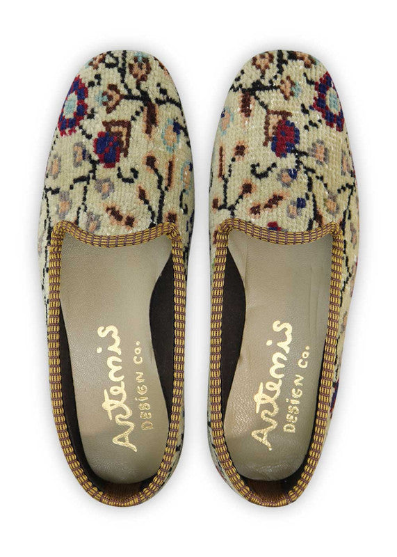 The Artemis Women's Loafer features a captivating color combination of khaki, black, peach, light grey, maroon, and blue. These loafers offer a harmonious blend of earthy and subtle tones with a pop of bold blue, creating a stylish and eye-catching effect. Whether you're going for a casual or sophisticated look, these loafers are the perfect choice to add a touch of elegance to your outfit. (Front View)