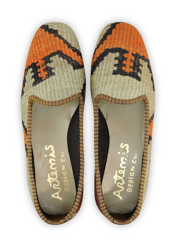 The Artemis Women's Loafer features a sophisticated color combination of maroon, black, grey, orange, and khaki. These chic loafers effortlessly blend timeless and modern hues, making them a versatile and stylish choice for any outfit. Whether you're going for a professional look or want to add a touch of elegance to your casual attire, these loafers have you covered. (Front View)