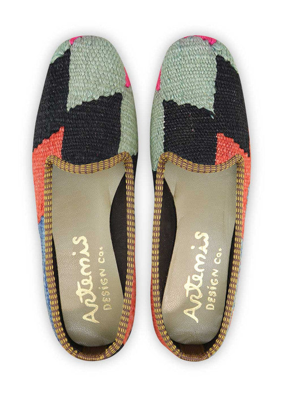 The Artemis Women's Loafer showcases a captivating color combination of blue, mint green, fuschia, black, and red orange. These striking loafers are a true fashion statement, blending bold and vibrant hues that are sure to turn heads. Perfect for adding a burst of color to your wardrobe, these stylish loafers are designed to make you stand out with confidence and flair.  (Front View)