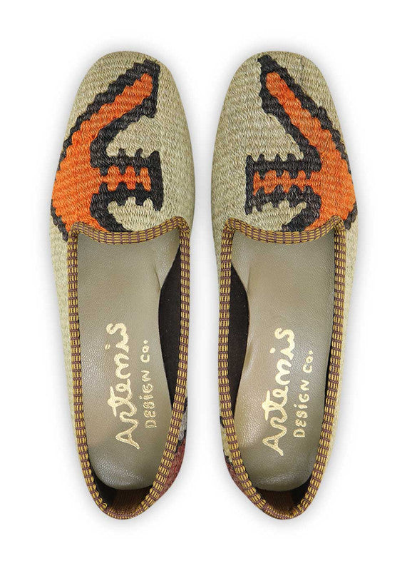 These stylish loafers showcase a sophisticated color combination of khaki, black, maroon, orange, and grey. Crafted with impeccable attention to detail, these loafers offer a timeless appeal that effortlessly complements any outfit. The combination of classic and contemporary hues adds a touch of refinement to your ensemble, while the high-quality materials ensure durability and comfort.  (Front View)