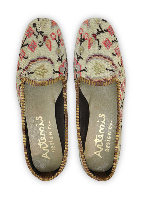 These loafers feature a harmonious blend of colors that create an elegant and refined design. The khaki and brown tones provide a natural and earthy feel, while the peach and light grey hues add a touch of softness and femininity. The red serves as a bold and eye-catching accent, injecting a pop of vibrancy to the overall palette. (Front View)