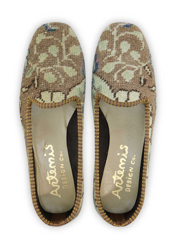 These loafers showcase a refined design with a harmonious blend of neutral and cool tones.  The khaki and light brown hues provide a natural and earthy touch, while the blue adds a subtle pop of color for visual interest. The white serves as a crisp and clean accent, creating a balanced and sophisticated color palette. (Front View)