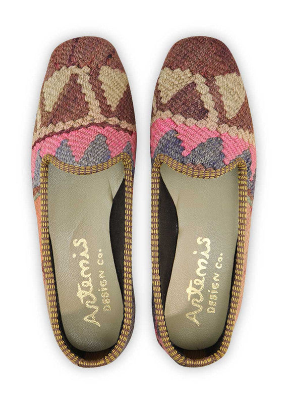These loafers showcase a harmonious blend of soft and earthy tones, creating a visually appealing and versatile footwear option. The peach hue adds a touch of femininity and warmth, while the brown and khaki accents bring a natural and grounded vibe. The pink undertones add a playful and vibrant touch, while the light grey and grey elements provide a clean and modern backdrop. (Front View)