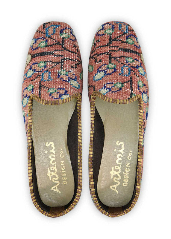 These loafers offer a delightful blend of soft and vibrant hues, creating a visually pleasing and versatile footwear option. The peach shade adds a touch of femininity and warmth, while the blue and green accents bring a refreshing and lively vibe. The off-white and khaki elements provide a neutral and classic base, while the purple adds a pop of depth and sophistication. (Front View)