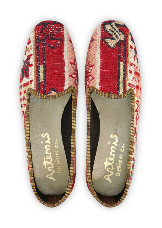 These loafers effortlessly blend bold and refreshing hues, creating a visually striking and versatile footwear option. The crisp white serves as a clean and timeless backdrop, while the vibrant red, moss green, peach, and blue accents add a pop of color and personality. With their comfortable fit and classic loafer design, these Artemis Women's Loafers are perfect for adding a stylish touch to your outfit. (Front View)