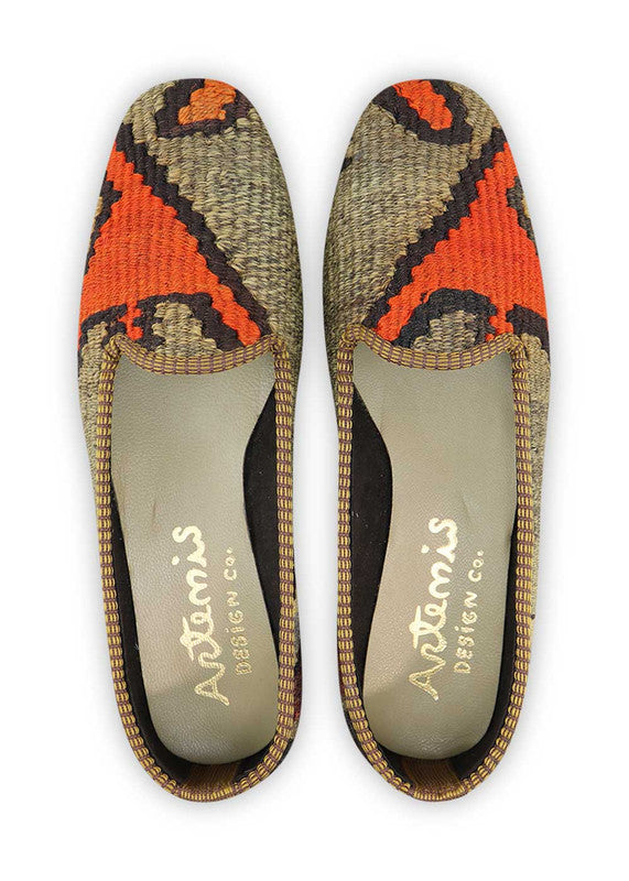 Artemis Women's Loafer Shoes in a captivating color combination of grey, light grey, orange, black, and sky blue. These loafers showcase a harmonious blend of cool and vibrant tones, creating a modern and eye-catching look. The shades of grey provide a sleek and versatile base, while the pops of orange and sky blue add a playful and refreshing touch. The black accents add a touch of sophistication and balance to the overall design. (Front View)