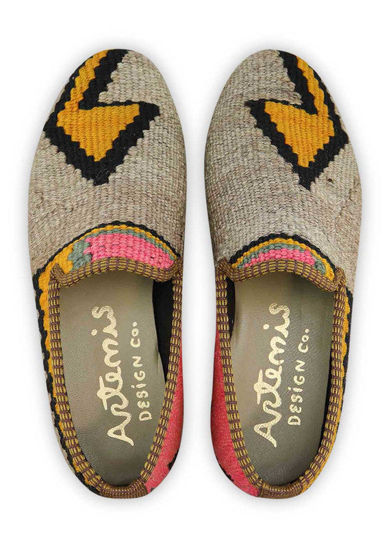 The Artemis Women's Smoking Shoe features a striking color combination of grey, pink, red, black, and yellow. These smoking shoes offer a bold mix of contrasting and vibrant tones, creating a chic and eye-catching look. (Front View)