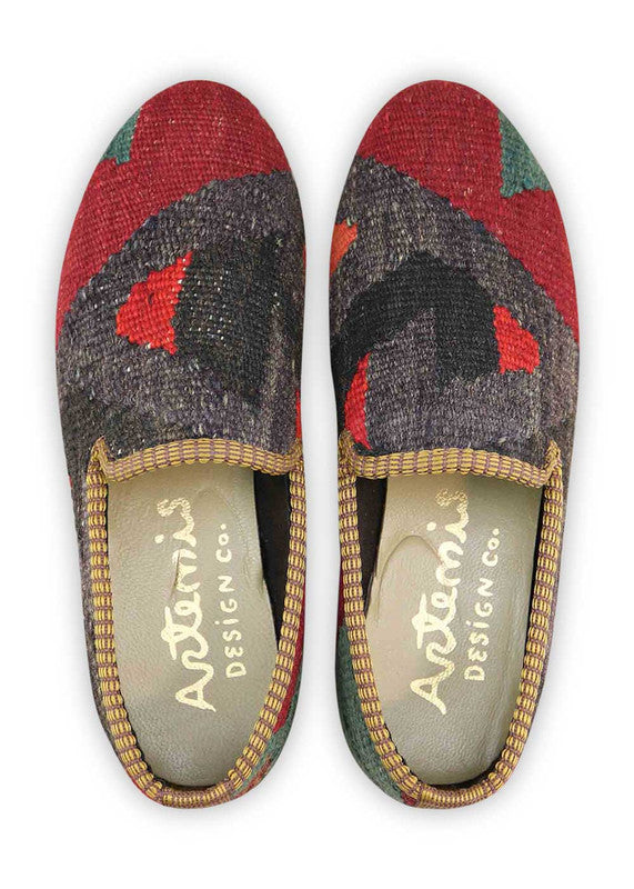The Artemis Women's Smoking Shoe features a bold color combination of black, dark grey, red orange, red, and green. These smoking shoes offer a dynamic mix of contrasting and vibrant tones, creating a chic and eye-catching look. (Front View)